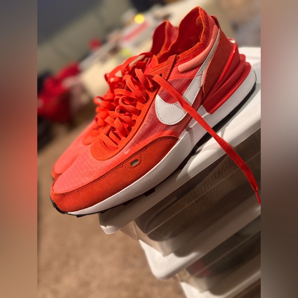 Orange running Nike shoes
